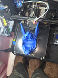 3D printed blue dragon skull pen holder fresh off the printer — top view showing hollow interior