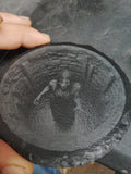 Custom laser engraved slate — circular piece with detailed figure engraving